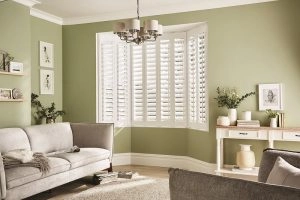 Vinyl window shutters in a lounge bay window