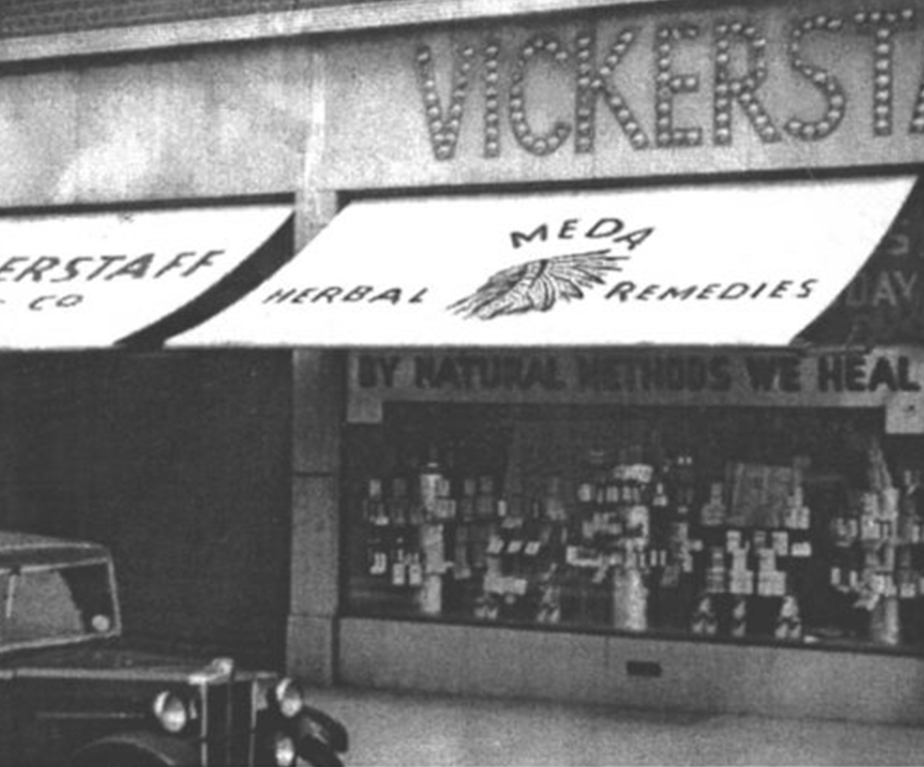 black and white photo of an old shop