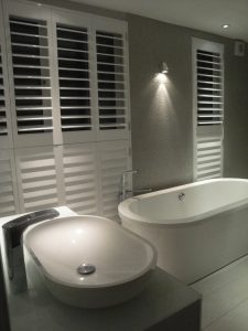 bathroom shutters with bottom half closed for privacy